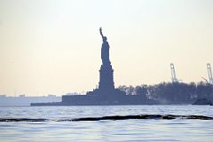 26-02 Statue Of Liberty From Battery Park In New York Financial District